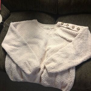 A sweet crop sweater with buttons